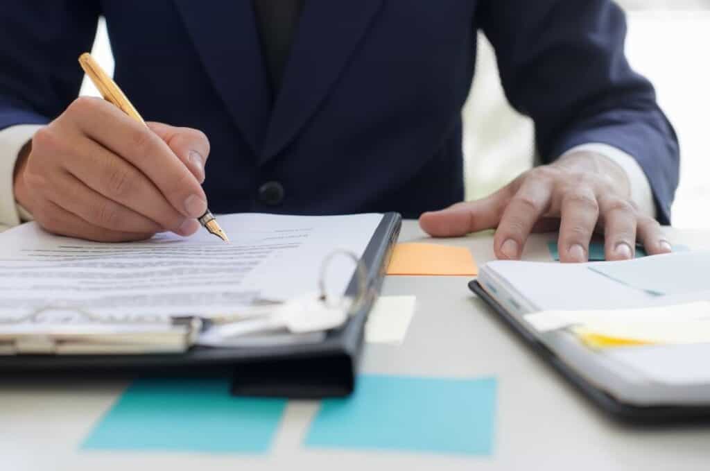 IT professionals implementing ISO 27001 framework to safeguard sensitive company information.