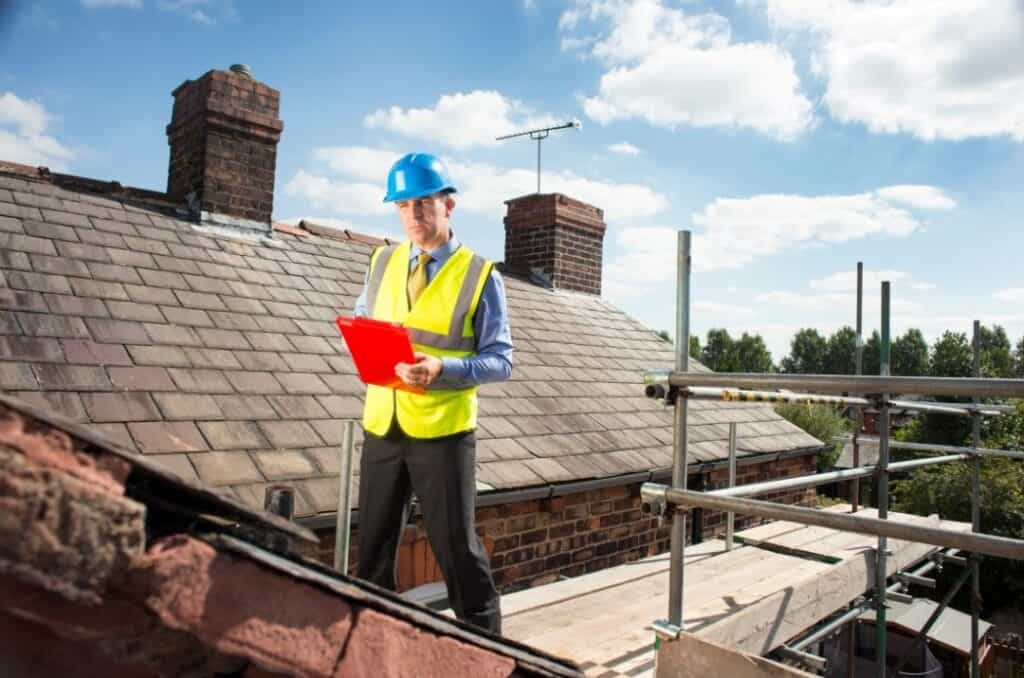 Consultant discussing retrofit options with a Leeds property owner for energy-efficient upgrades.